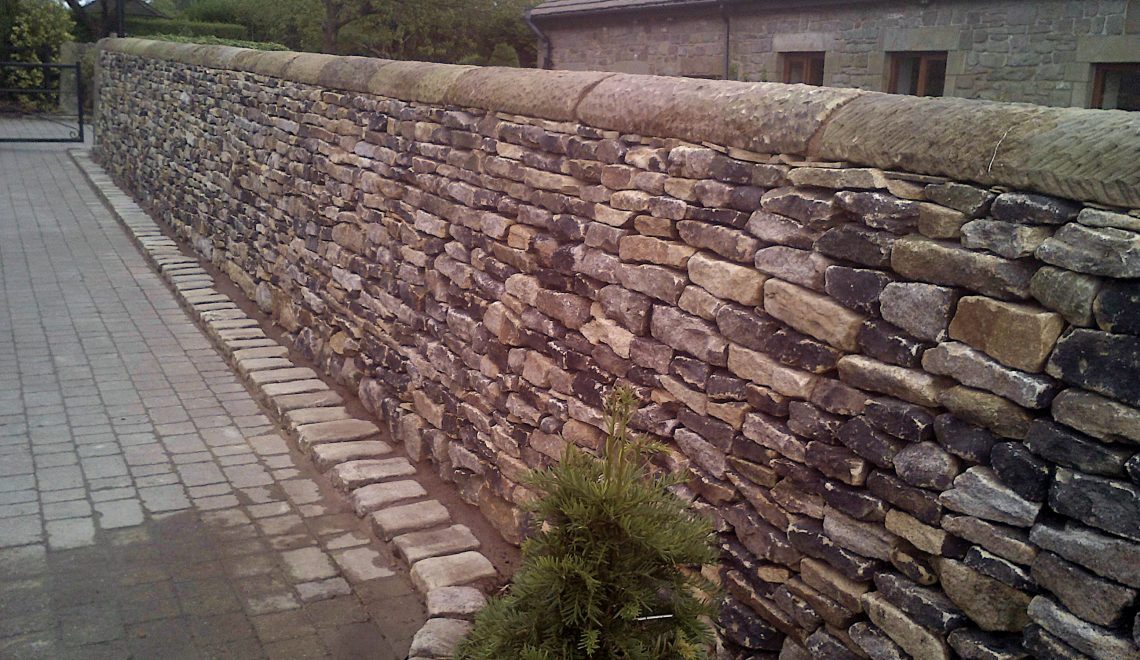 Dry stone boundary wall gritstone