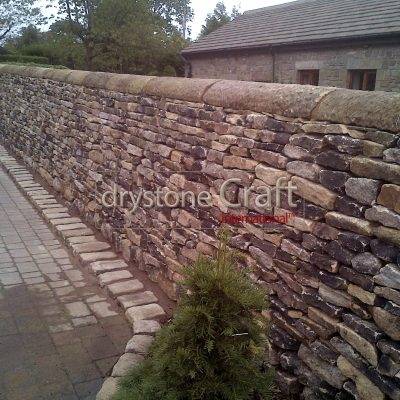 Dry stone boundary wall gritstone